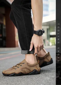 Detail view of brown men's casual shoes with distinctive hand-stitched detailing.