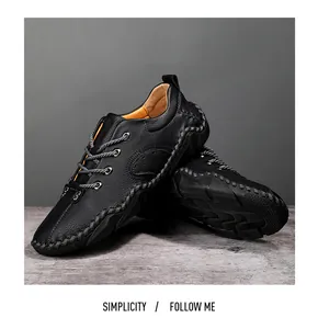 Close-up of men's black leather casual shoes with hand-stitched details and rope laces.