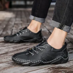 Stylish men's black leather casual shoes with hand-stitched details and lace-up closure