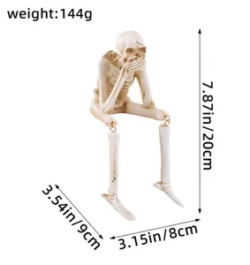 Dimensions détaillées pour cette figurine de squelette assise d'Halloween