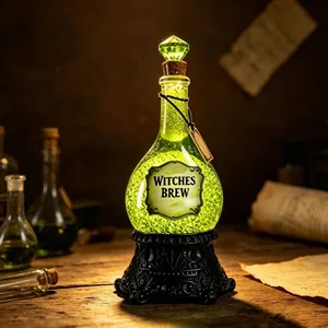 Detailed view of a glowing green Halloween resin potion bottle with Witches Brew label
