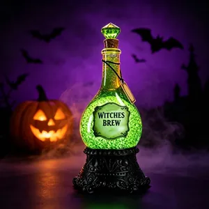 Glowing green Halloween potion bottle decoration with Witches Brew label and resin base