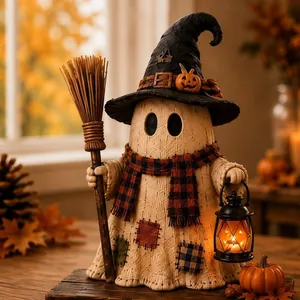 Close-up of Halloween ghost monster decoration with lantern and broom, textured detail