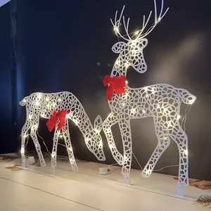 Detailed view of white metal reindeer decor with integrated warm yellow LED lights