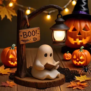Detailed view of resin ghost reading lamp with glowing jack-o-lantern background