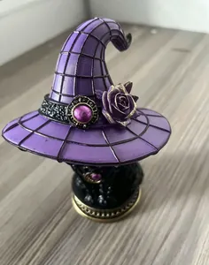 Detailed macro view of a gothic purple witch hat resin lamp for Halloween home decor