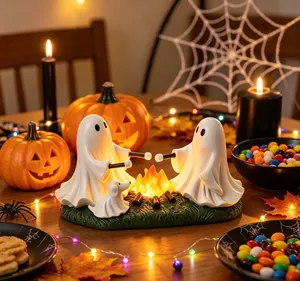 Detailed close-up of resin ghost night light roasting marshmallows for Halloween decoration