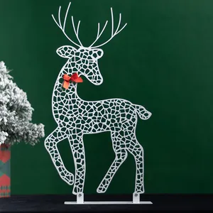 Elegant white metal cutout reindeer ornament with red bow for Christmas table decor