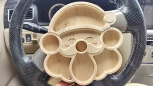 Macro detail of the Santa Claus shaped wooden divided tray for Christmas snacks