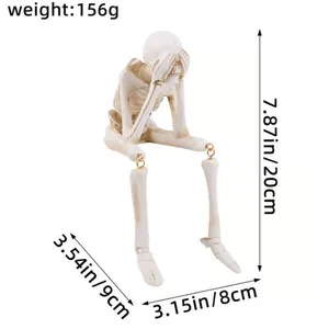 Figurine de squelette d'Halloween assise avec dimensions pour un décor effrayant