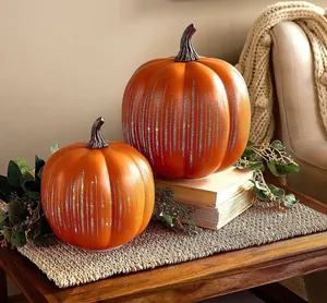 Elegant orange glass pumpkins with vertical etched patterns for Halloween home decor