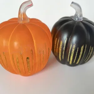 Starry night glass pumpkin set in orange and black for Halloween home decor.