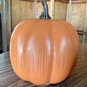 Decorative orange glass pumpkin with glitter stripes for Starry Night Halloween decor