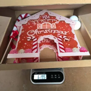 Weight measurement of a 619.5g gingerbread house target for golf game set