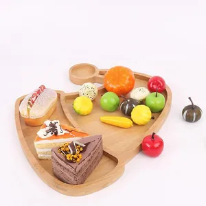 Detailed view of a reindeer shaped wooden serving tray with functional compartments