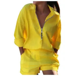 Detailed view of women's yellow casual set with large ring zipper neckline