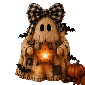 Handcrafted Halloween ghost decoration with glowing star lantern and plaid bow