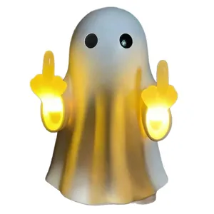 Creative funny Halloween ghost wall light with middle finger gesture and warm yellow glow.