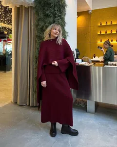 Elegant burgundy three-piece knit set featuring a ribbed sweater, midi skirt, and shawl.