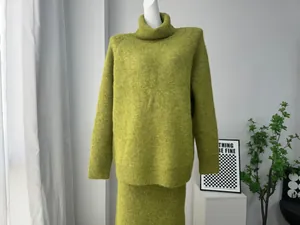 Macro detail showing the soft wool blend texture of an oversized avocado green knit set