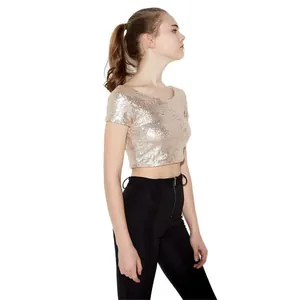 Side view showing the fit of a sparkling champagne gold sequined crop top for women