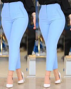 Close-up detail of light blue high-waisted slim fit cropped suit trousers with zipper