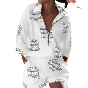 Women's white two-piece shorts set featuring cursive script print and front zipper