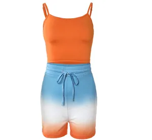 Front view of vibrant orange crop camisole and blue white orange gradient shorts set