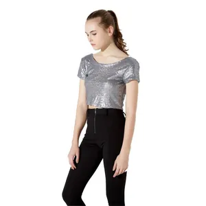 Close-up detail of a shiny silver sequin crop top with a scoop neck and short sleeves