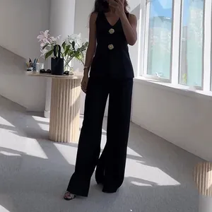 Elegant black V-neck sleeveless vest and high waist wide leg pants two-piece set.