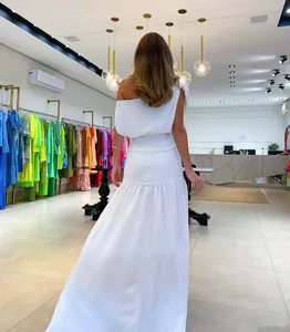 Elegant white one-shoulder off-shoulder maxi dress with floor-length hem and cinched waist back view