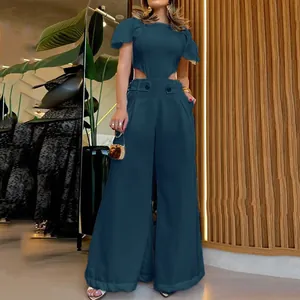 Detail of a chic cut-out waist wide-leg jumpsuit set in deep teal for summer fashion