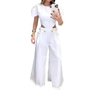 Chic white two-piece jumpsuit set with waist cutouts and gold button wide-leg trousers