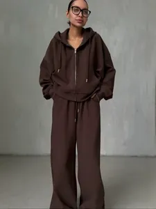 Dames oversized bruine hoodie met rits en trainingsbroek met wijde pijpen set