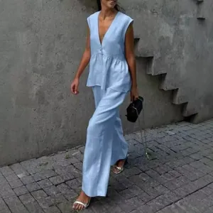 Model wearing elegant light blue sleeveless V-neck vest and loose wide-leg pants set