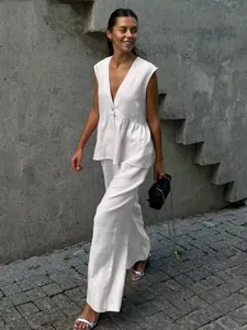 Minimalist white sleeveless V-neck vest and wide-leg trousers linen-style suit for women