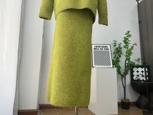 Close-up of moss green wool blend knitted two-piece set texture and drape
