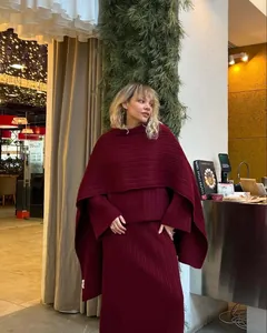 Detailed look of women's burgundy three-piece knitted sweater set featuring a cozy shawl