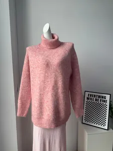 Pink wool blend knitted set with oversized high-neck sweater and matching trousers