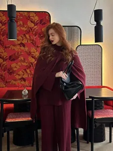 Women's burgundy three-piece knit set with sweater, wide-leg pants, and matching shawl