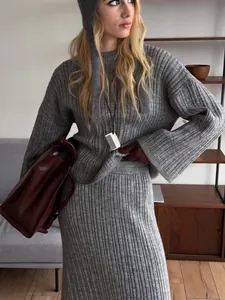 Chic grey ribbed knit sweater and midi skirt three-piece set with a matching knit hat