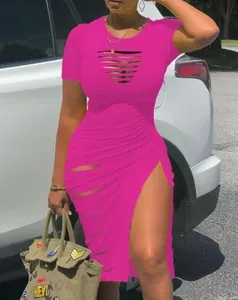 Close-up of hot pink bodycon dress featuring sexy cut-out and high slit detail.
