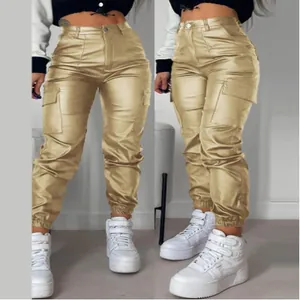 Close-up detail of women's metallic gold PU cargo pants with stylish side pockets