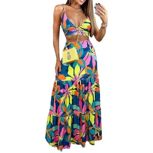 Elegant floral print two-piece set with V-neck camisole crop top and tiered maxi skirt.