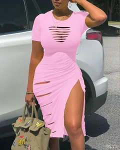 Close-up detail of a pink short-sleeved bodycon dress featuring sexy front cut-outs