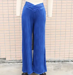 Blue high-waisted wide-leg pants with wave pattern and unique cutout waist detail