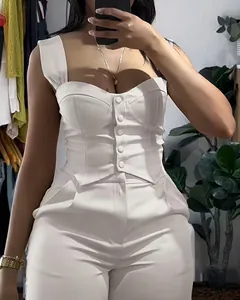 Close-up of elegant white two-piece set featuring a corset top and wide-leg pants
