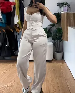 Elegant white two-piece set featuring a button-up corset top and wide-leg trousers for women