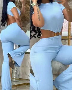 Close-up detail of a light blue ribbed jumpsuit featuring a stylish waist cutout with a ring
