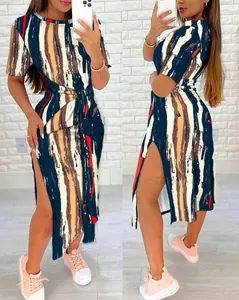 Detailed view of women's short sleeve split dress with abstract print and waist tie